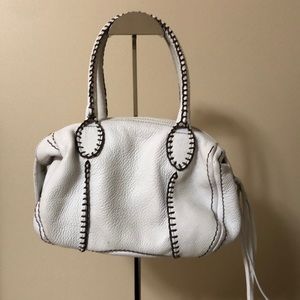 Carlos Falchi hand bag. White with brown stitching. Zipper closure.